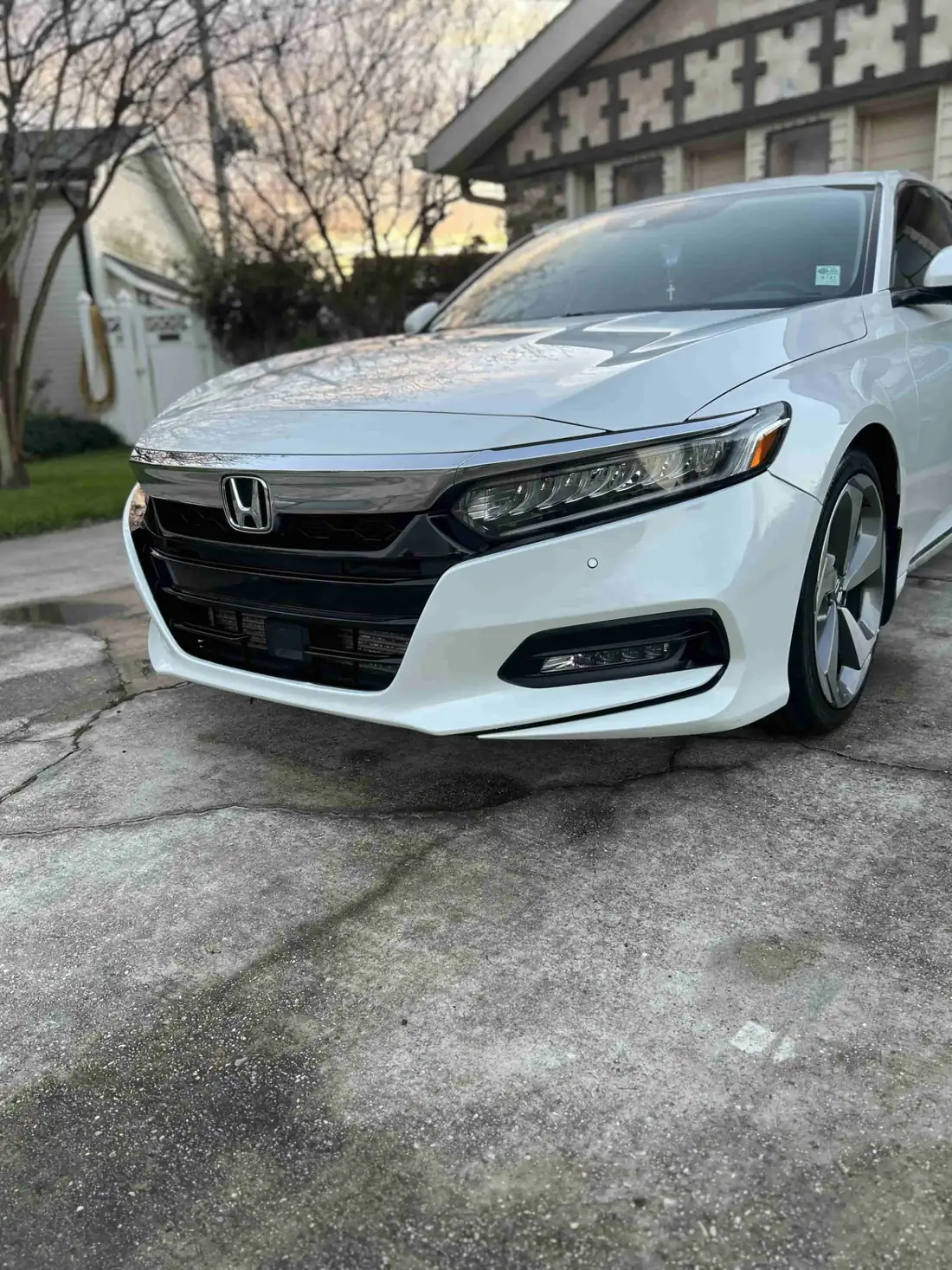 White Honda Accord with polished paint and clean wheels after a mobile car detail in Kenner, LA