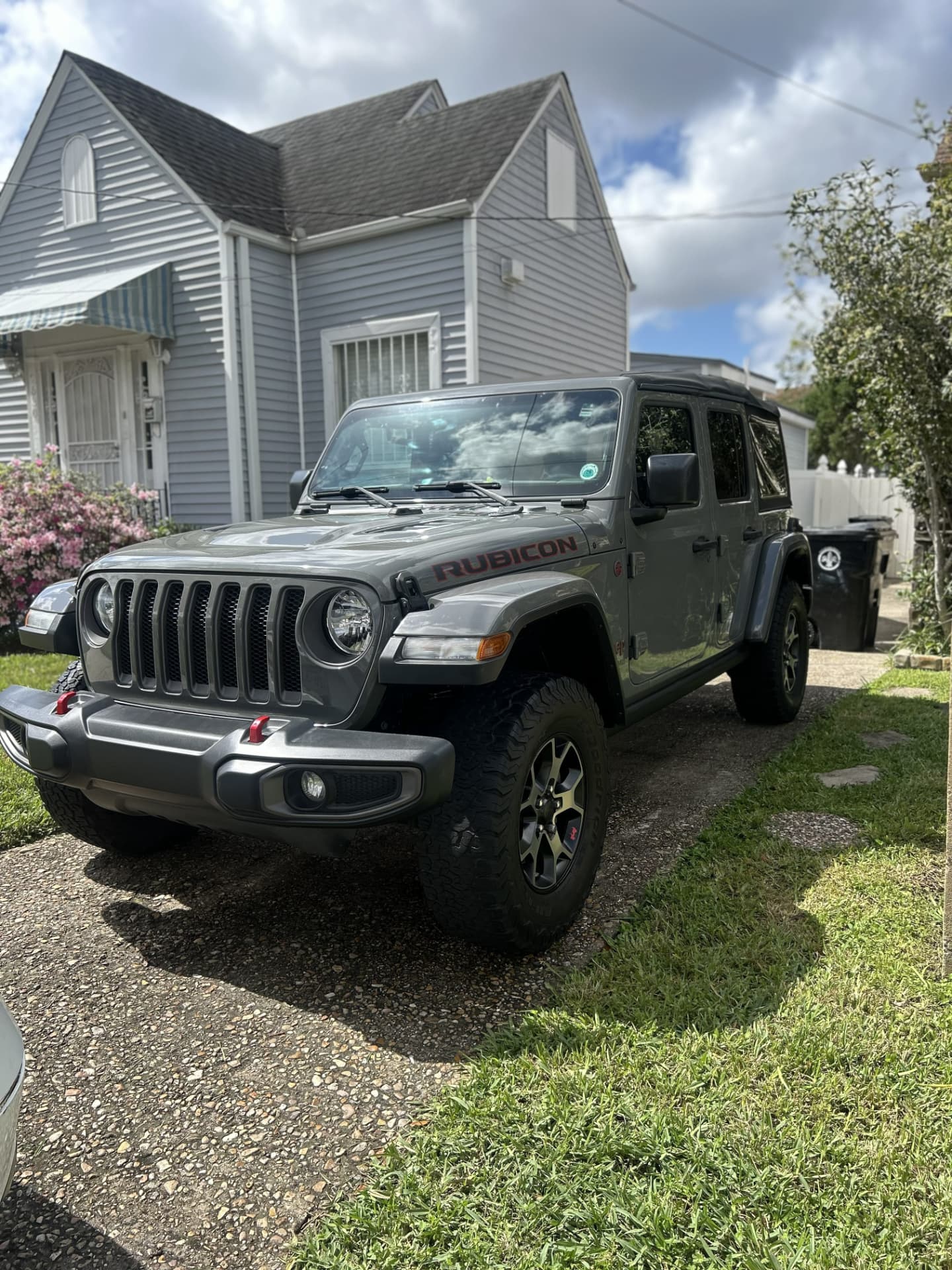 Jeep Wrangler Rubicon detailed in a New Orleans driveway with clean tires and glossy paint